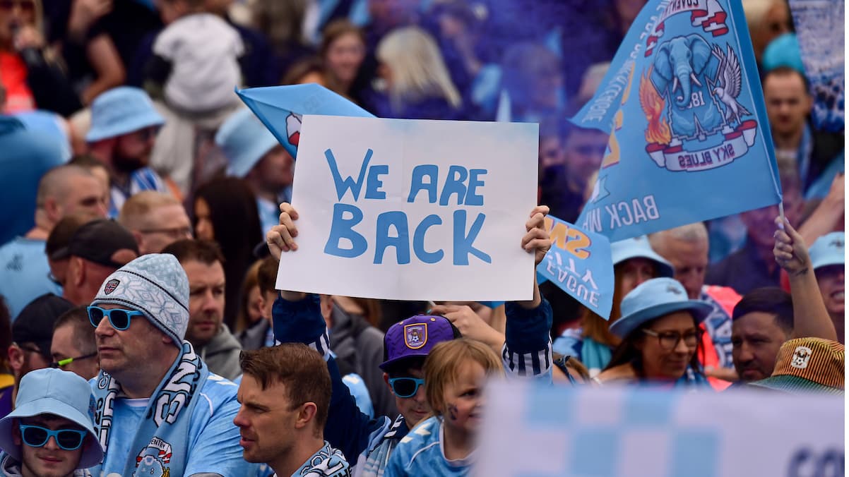 A “we are back poster: in the crowd during the Promotion Parade for Coventry City at the Coventry Building Society Arena, Coventry, UK on 4 May 2026.